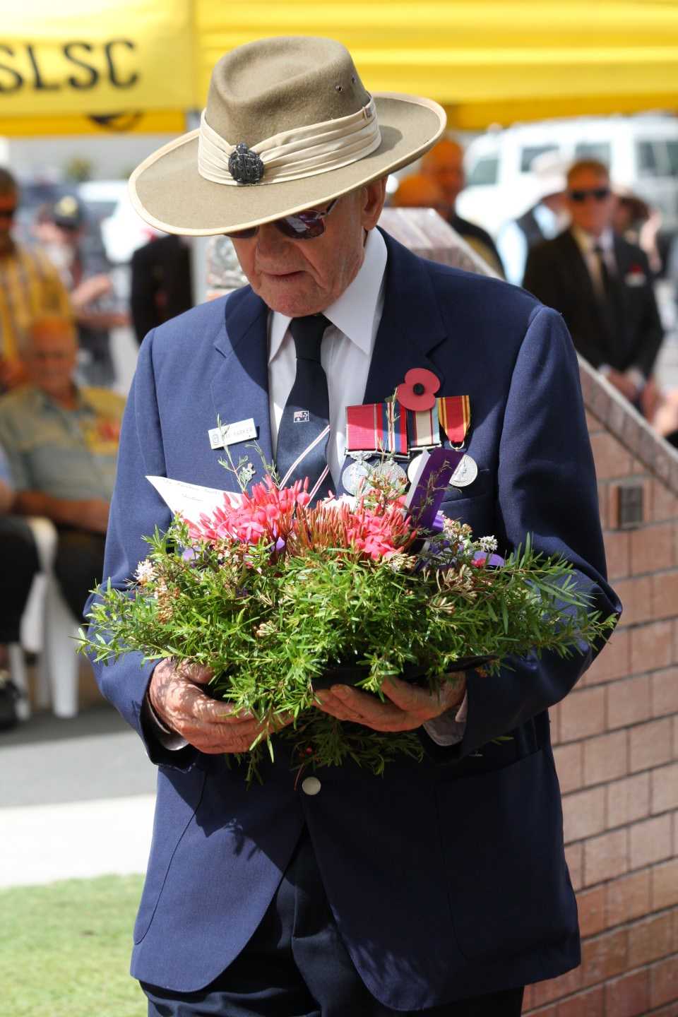 Ray Parker lays a wreath at the Rainbow Beach Cenotaph last year