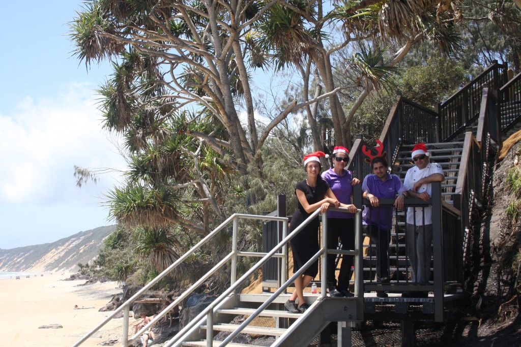 Talia from Arcobaleno and Renae, John and Simon from Rainbow Beach Hotel say Christmas has come a little early - council have just opened our brand beach steps