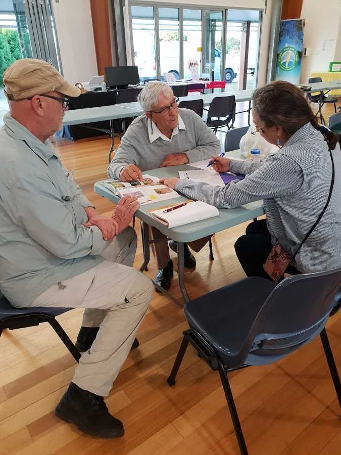 Dr Don Sands (centre) will be back in Rainbow Beach for a public presentation on October 6