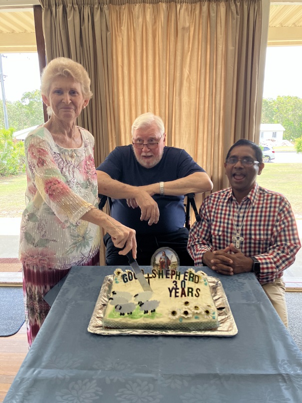 Annette Collins, Rev. Kev Lewis, and Rev. Shaji Joseph cut the cake made by Sandra Strohfeldt. Photo supplied by Beris Trainer.