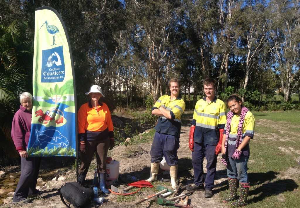 Cooloola Cove resident Chris Housten (left) is happy with the new drain design on the reserve behind her house. Helping to plant the wetland species are Jess Milne, Jaquob Wilcox, Kane Averillo and Talitta Lynch