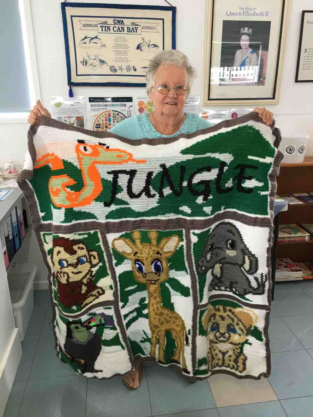 Mollie with her crocheted jungle theme rug, her entry in the QCWA Knitting Competition