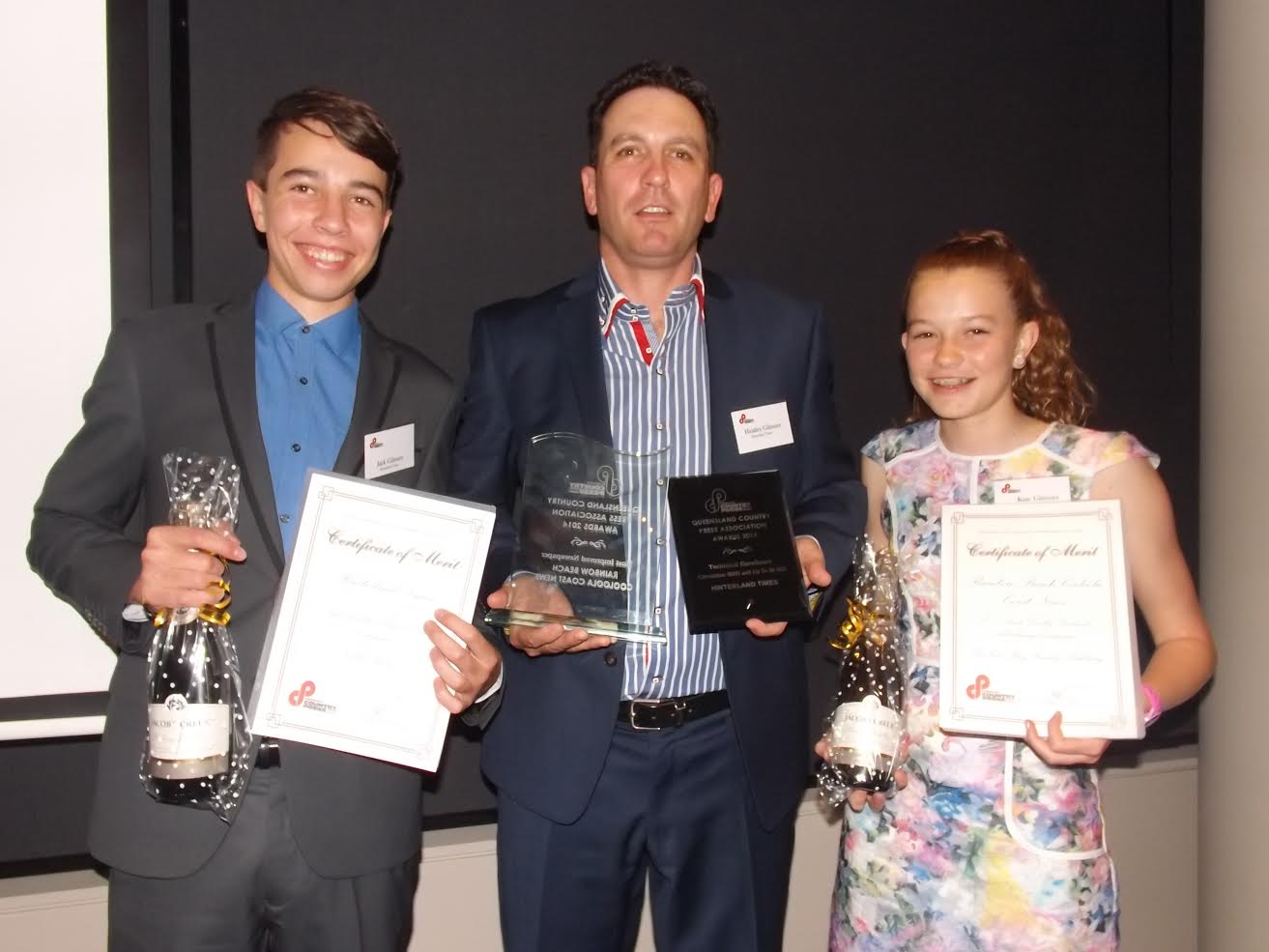 Heatley Gilmore with eldest two Jack and Kate with the “haul of takeaways"  from the Queensland Country Press Association Awards Image courtesy Les and Adele Jasper