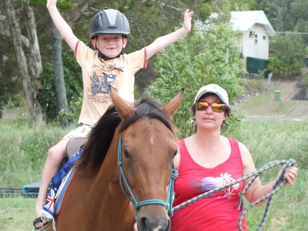 Ryan Sharman happy on a horse at the Rainbow Beach Markets