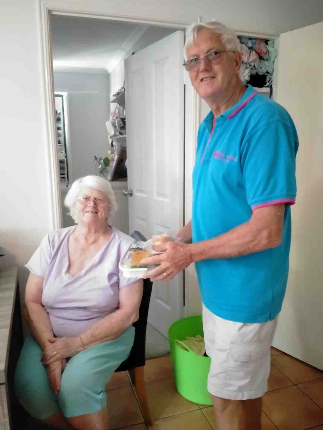 Meals on Wheels volunteer, Don Collins, delivers a meal to client, Delmai Kendal, and invites you to come along and meet the volunteers at Rainbow Beach