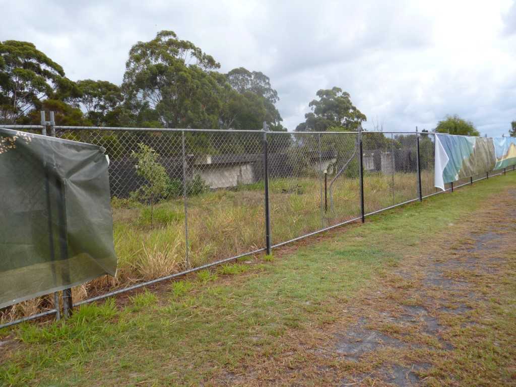 Panels from the screen at the town entrance were removed - can you help identify the thief?
