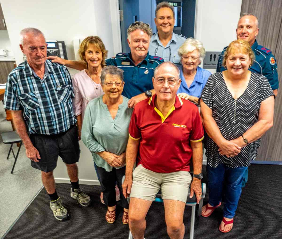 LAC members Jenny Miller, Phil Heron, Rod Jordan, Shirley McLean, Caroline Taylor, Cherie Mason with Queensland Ambulance district director Robert Cornthwaite, paramedic Steve Groves and Craig Ainsworth - and, of course, the brand new Razer Lift Chair.