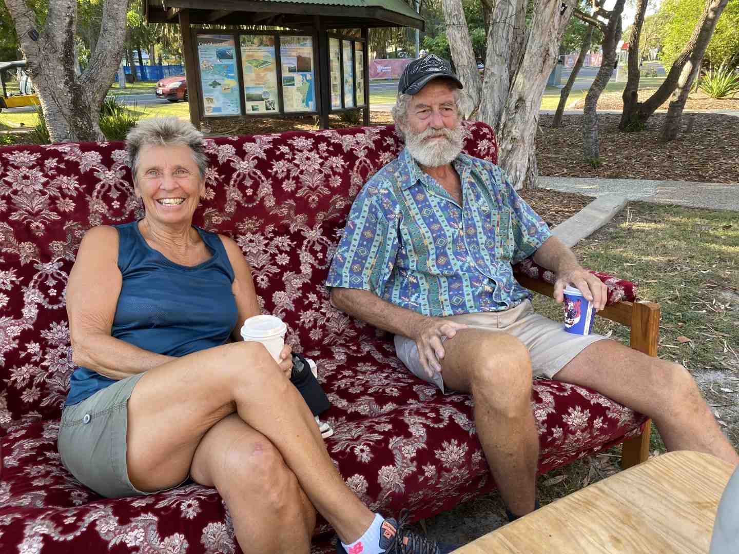 Pat Barone and Harvey Barkwell enjoy a coffee and chat on the Community Hall couch