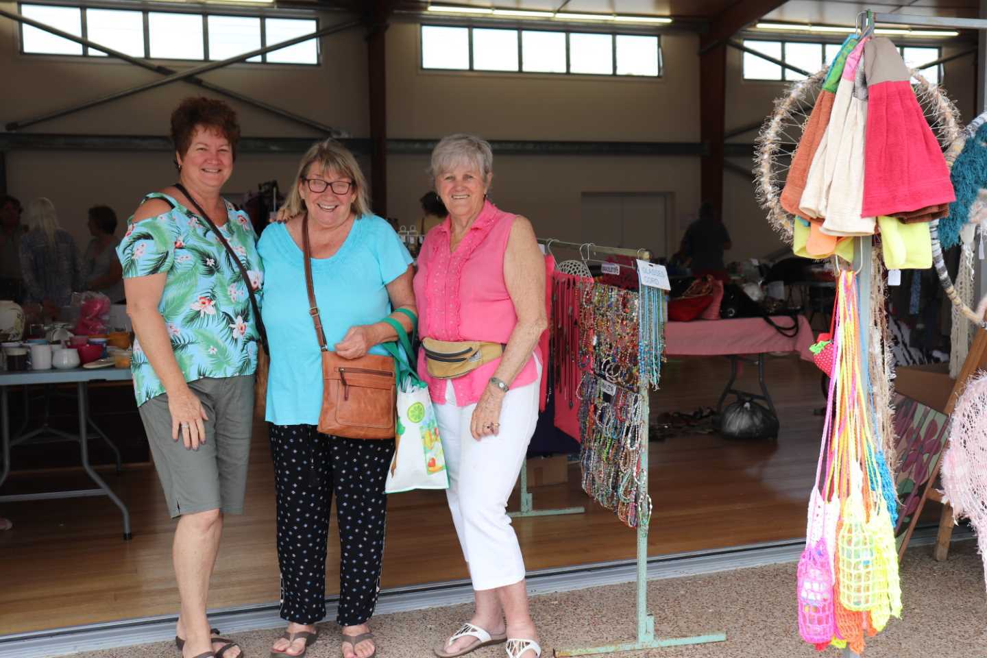 Kim Cozens, Glenda Eckle and Lyn Barrett catch up at the Craft Vintage and Recyclables Fair at the Rainbow Beach Hall