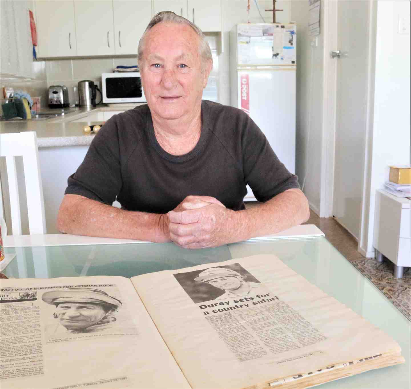 Local man, Bobby Durey with press cuttings from his days as one of Australia's leading jockeys. 