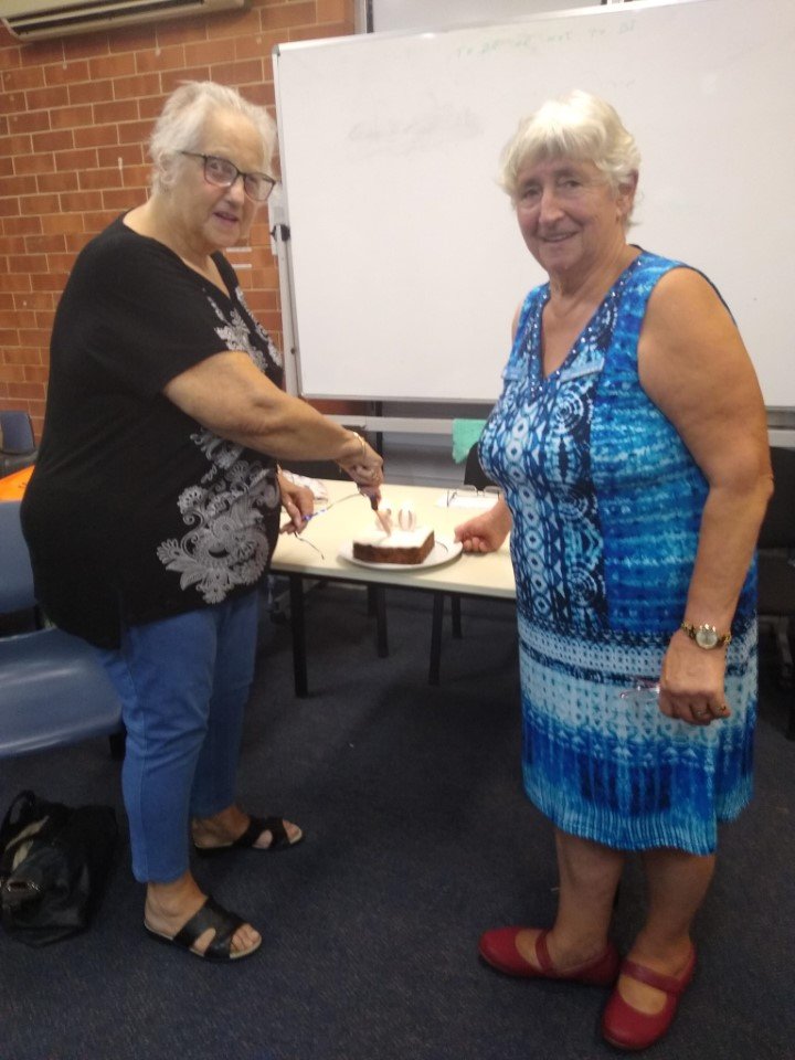Probus president, Jo Said, with new member, Barbara McKenzie, cutting her 80th birthday cake