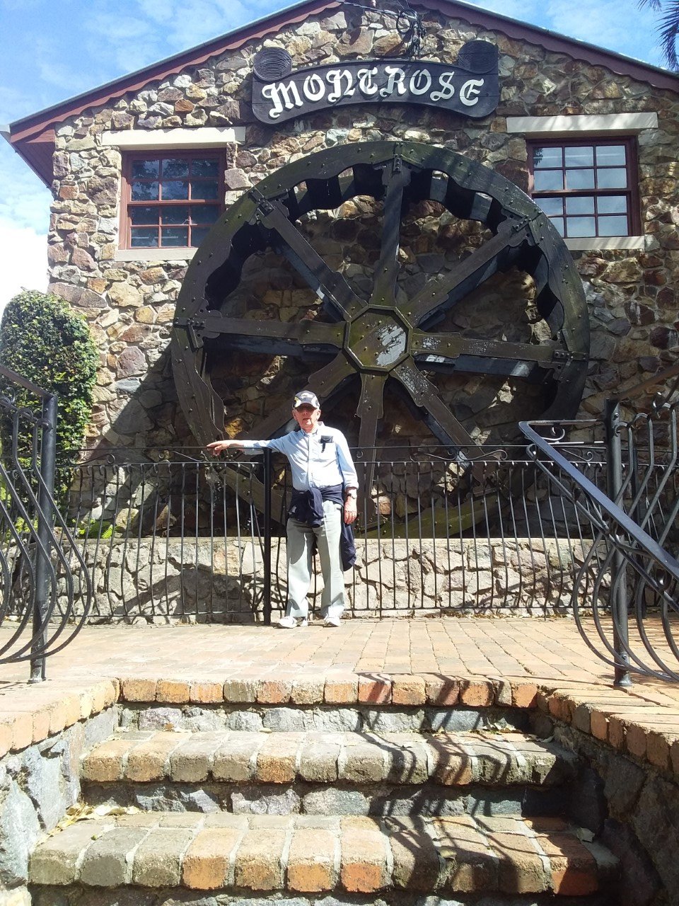 A worn-out Probian (John Olson) leaning up against the fence in front of the Montrose Waterwheel at Montville during a recent excursion