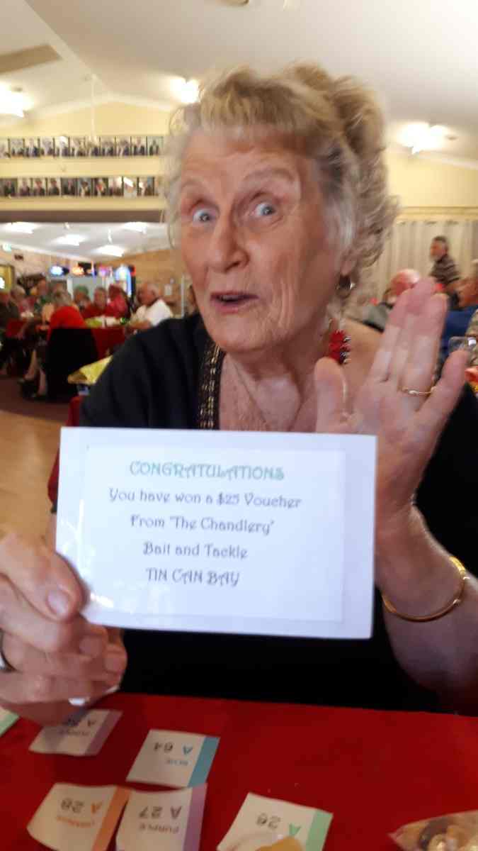 Cherryl was very happy with her raffle prize at Christmas in July - a voucher from The Chandlery Bait & Tackle