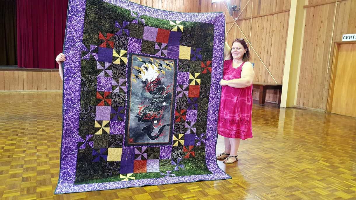 Sue Maddison with her beautiful quilt