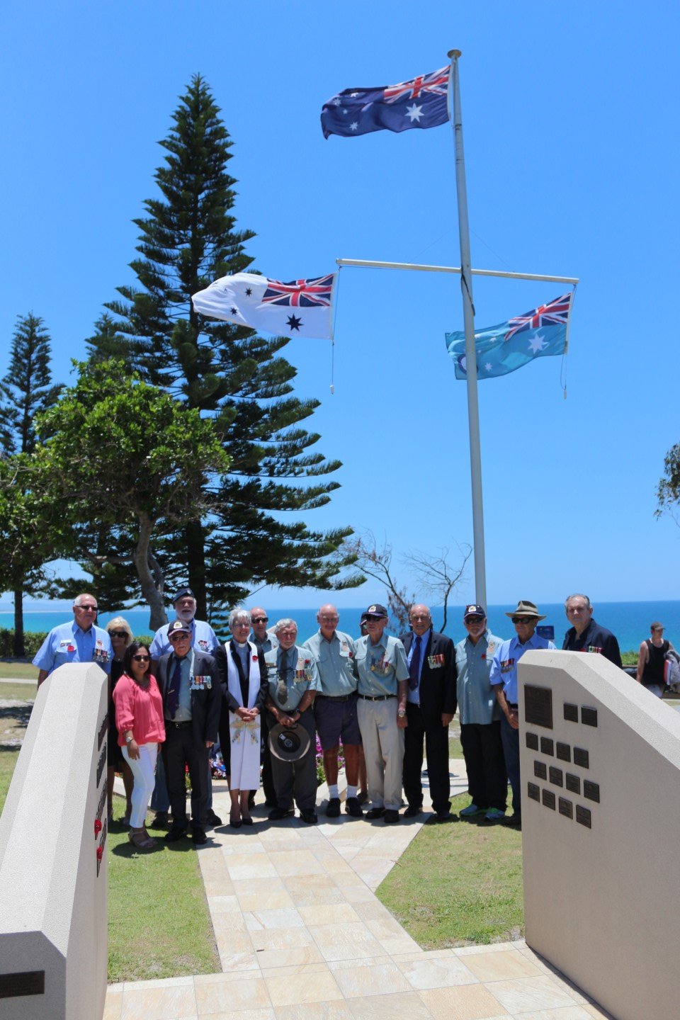Veterans with Reverend Ingrid Busk during the Rainbow Beach Remembrance Day Service. 