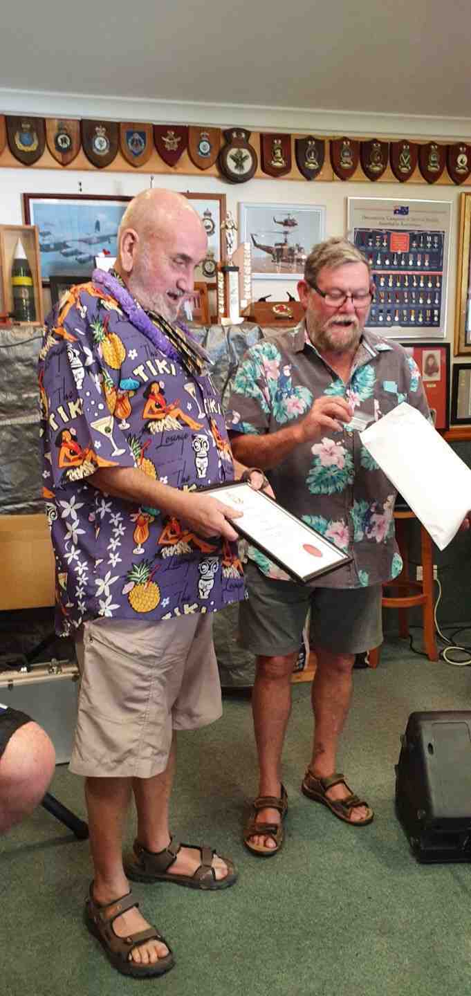 Terry Steele receiving his life membership certificate from TCB RSL President, Don Holland 