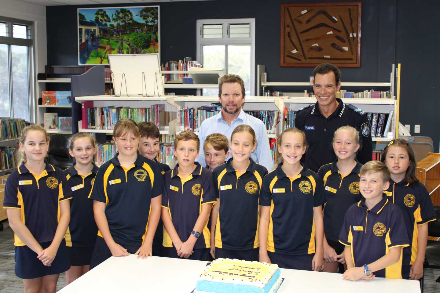 Principal Danny Stanieg and Senior Constable Mike Brantz congratulate the school leaders at their Induction Ceremony