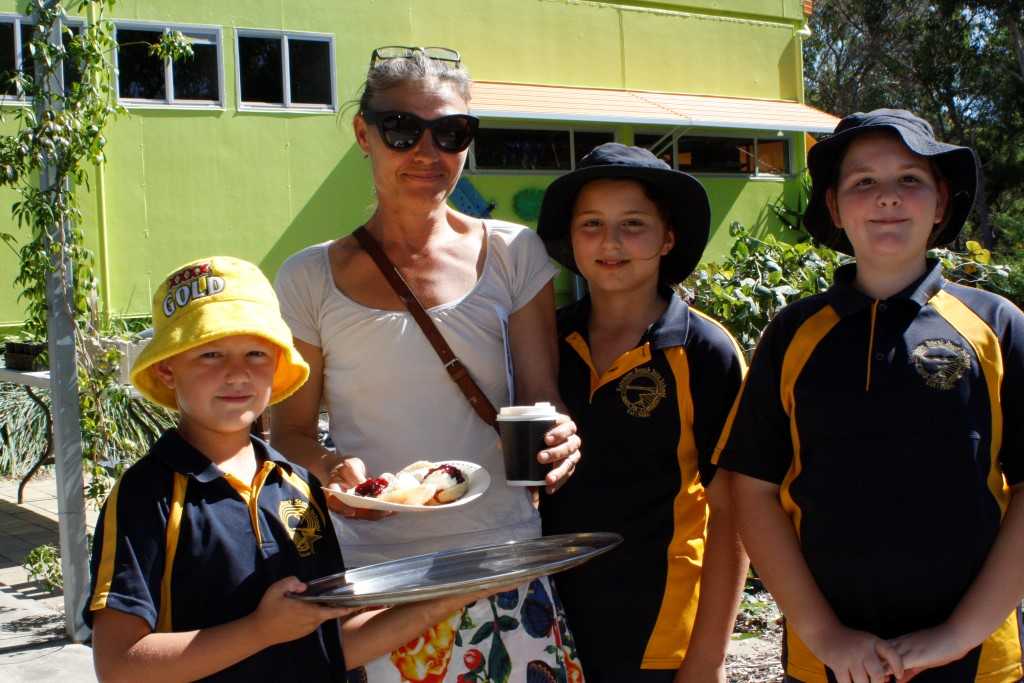 Guy Bergin serves up a cuppa and delicious scones made by Mrs Young's Grade 2/3 class to Denise Crowley, whilst Elva and Mikayla prepare for her tour