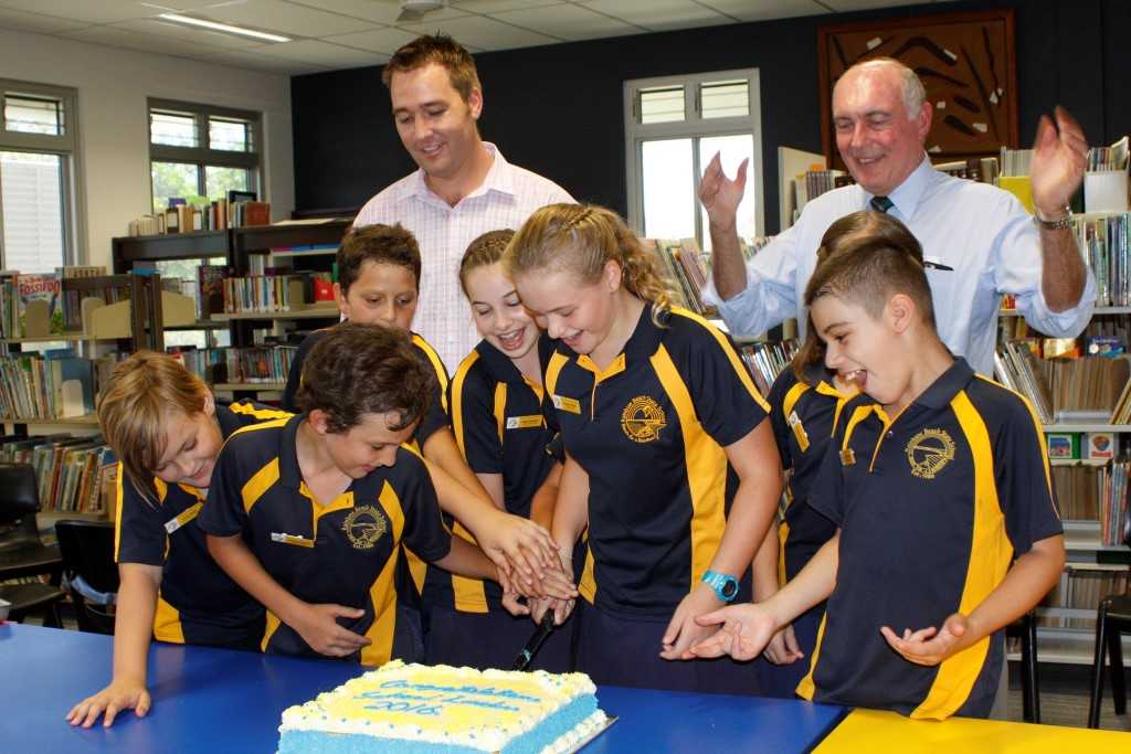 Micheal Grogran and Honorable Warren Truss, Federal Member for Wide Bay, congratulate the new student leaders as they cut the cake at the special celebratory morning tea with their families