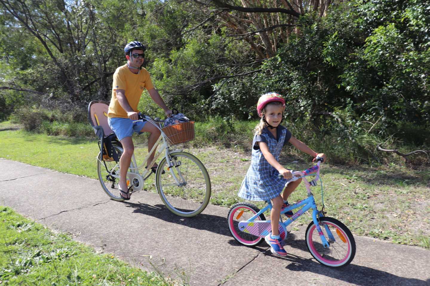 Grant Phelan and daughter Isabel ride home from school