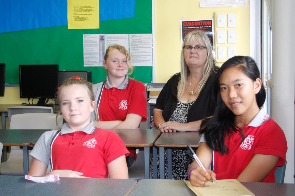 Girls with a purpose: Paris Delroy, Georgia Bogodoohoff, and Decemie Gabales with teacher, Robyn Cottrell