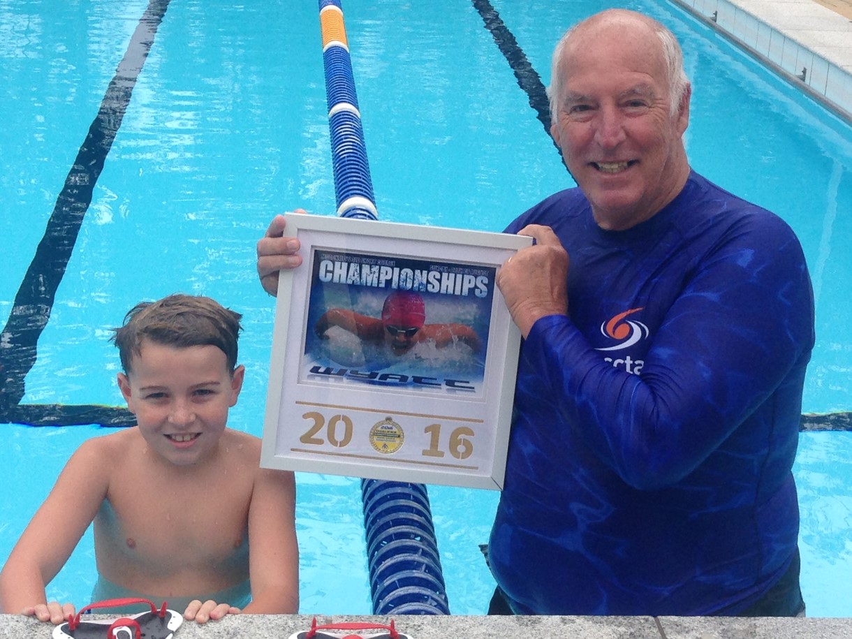 Wyatt Lee has had an awesome winter of swimming with an outstanding effort at Queensland State Championships last month, pictured with Crocs coach, Greg Rogers