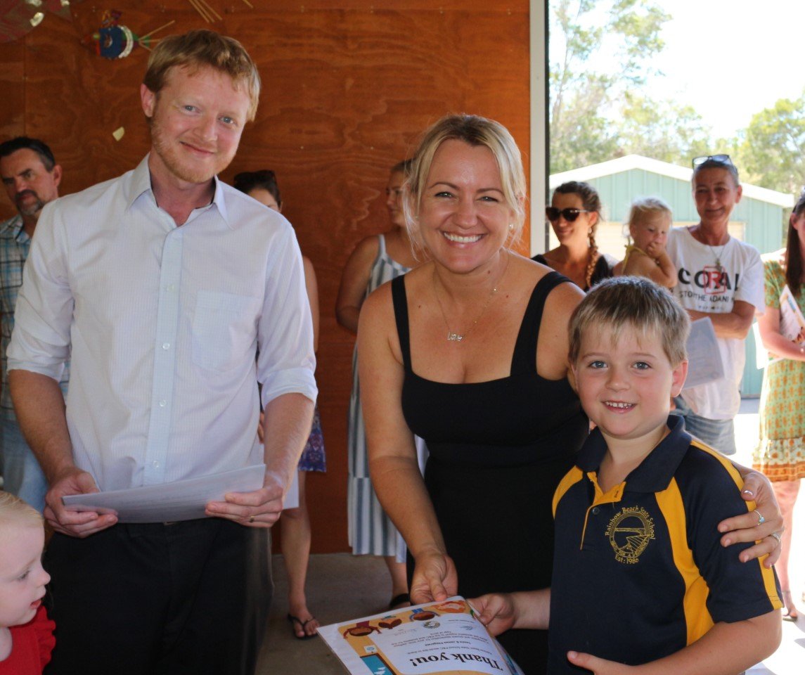 President of the School P & C Jed Elmer congratulating Tessia’s and James Fitzgerald. James sold his own drawings to raise money for the schools P & C. 
