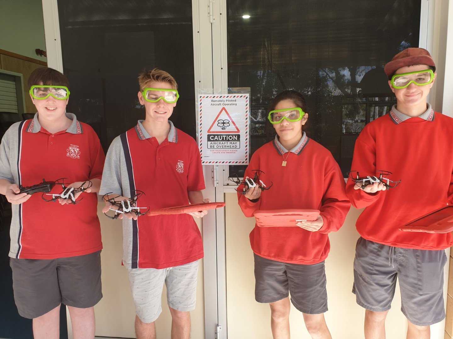 Digital Technology students, Ethan, Blake, Chloe and Jackson with the drones they made at the Tin Can Bay State School