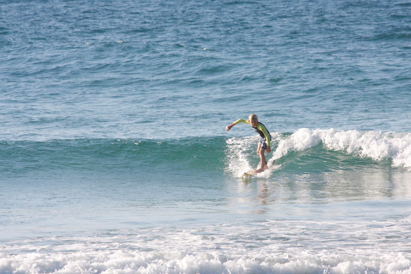 10-year-old Seth Parton surfs at Double Island Point
