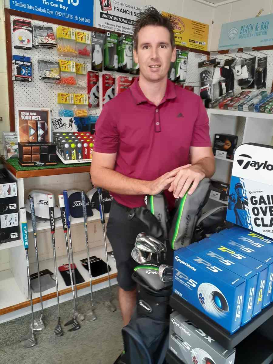 Professional Golfer James Taylor with new stock in the Pro Shop