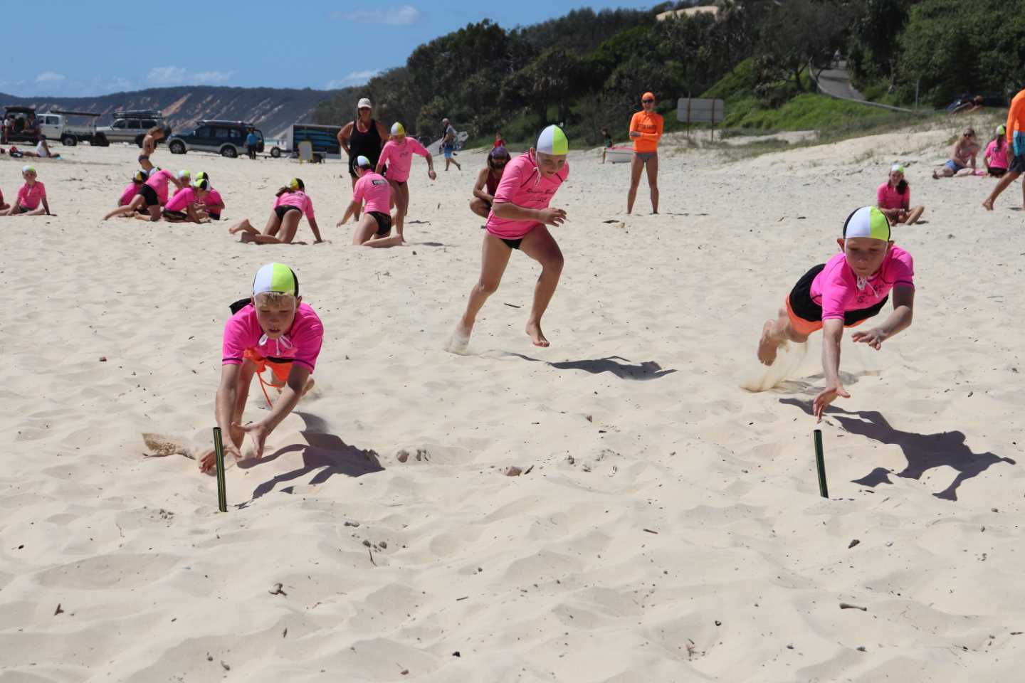 Dave Arthur coaches local nippers with tactics to secure the flag