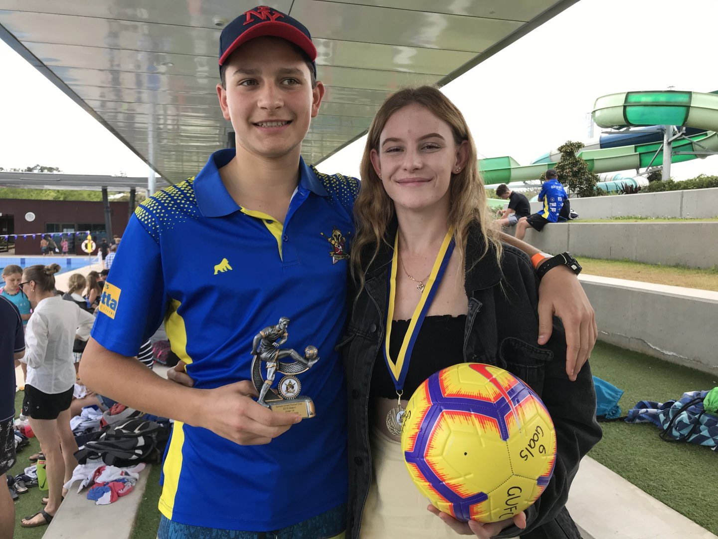 Rainbow Beach residents Archie Gilmore with his Player’s Player trophy for Under 14 Men and Abbey-Rose Cairns who won the Gol
