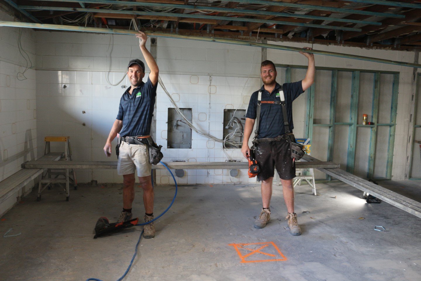Carlie Farlow and Travis Buchanan from DRM constructions working on the Rainbow Beach Surf Club renovations 