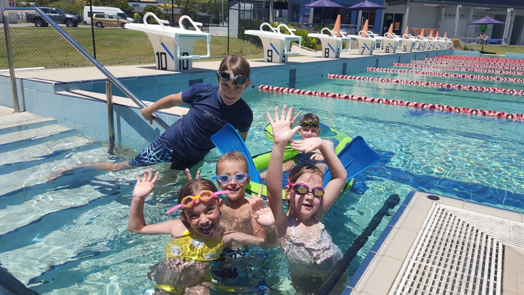 Ruby, Alex, Zoe and behind Zack and Joel enjoy a weekend hangout at the pool