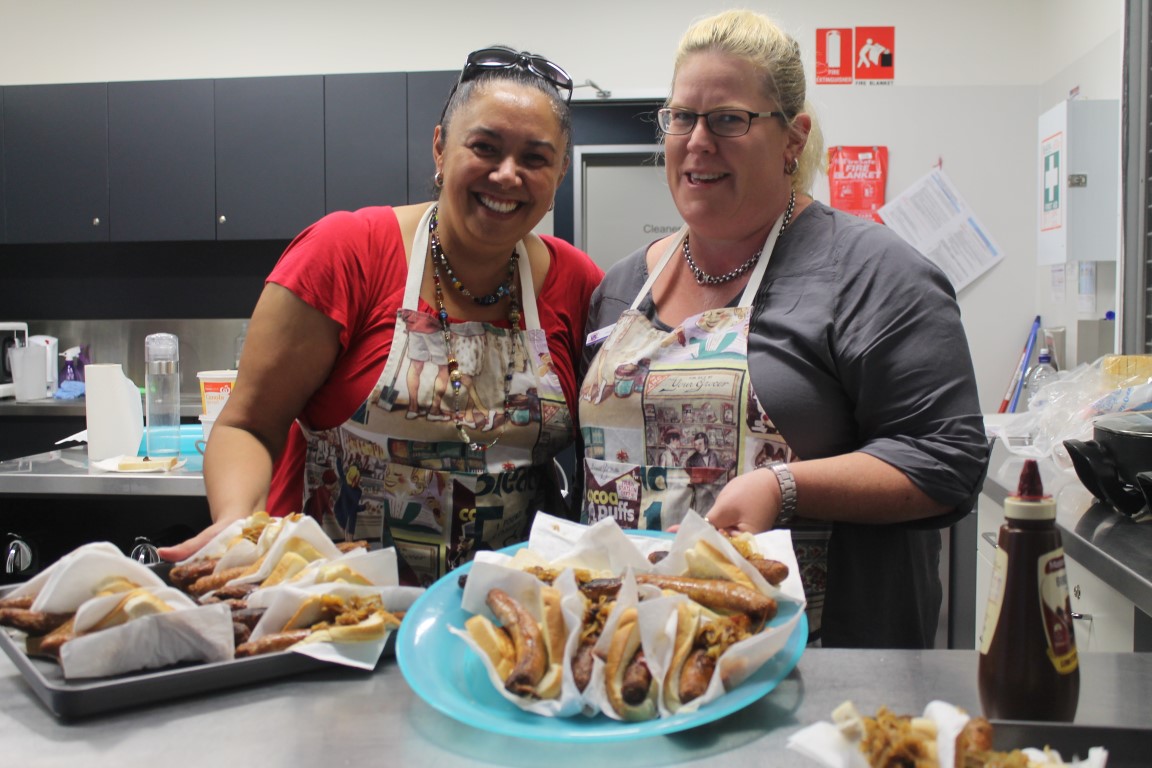 Serving up the snags, Leanne and Jayne