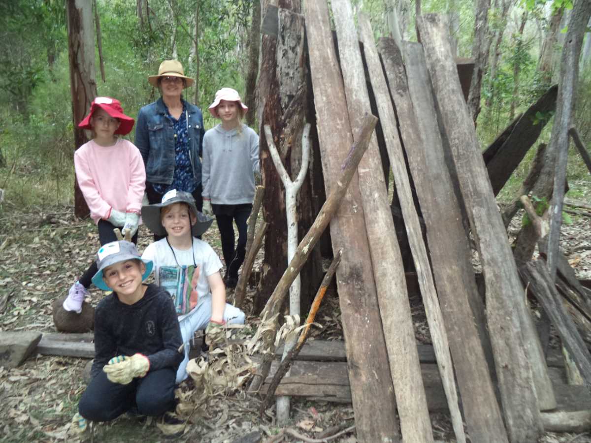 TCB SCHOOL - Shelter building - Teacher Aide Annette Bailey with students Chloe Wheeler, Harper Mills, Fletcher Hayward, and Byron Dunkinson