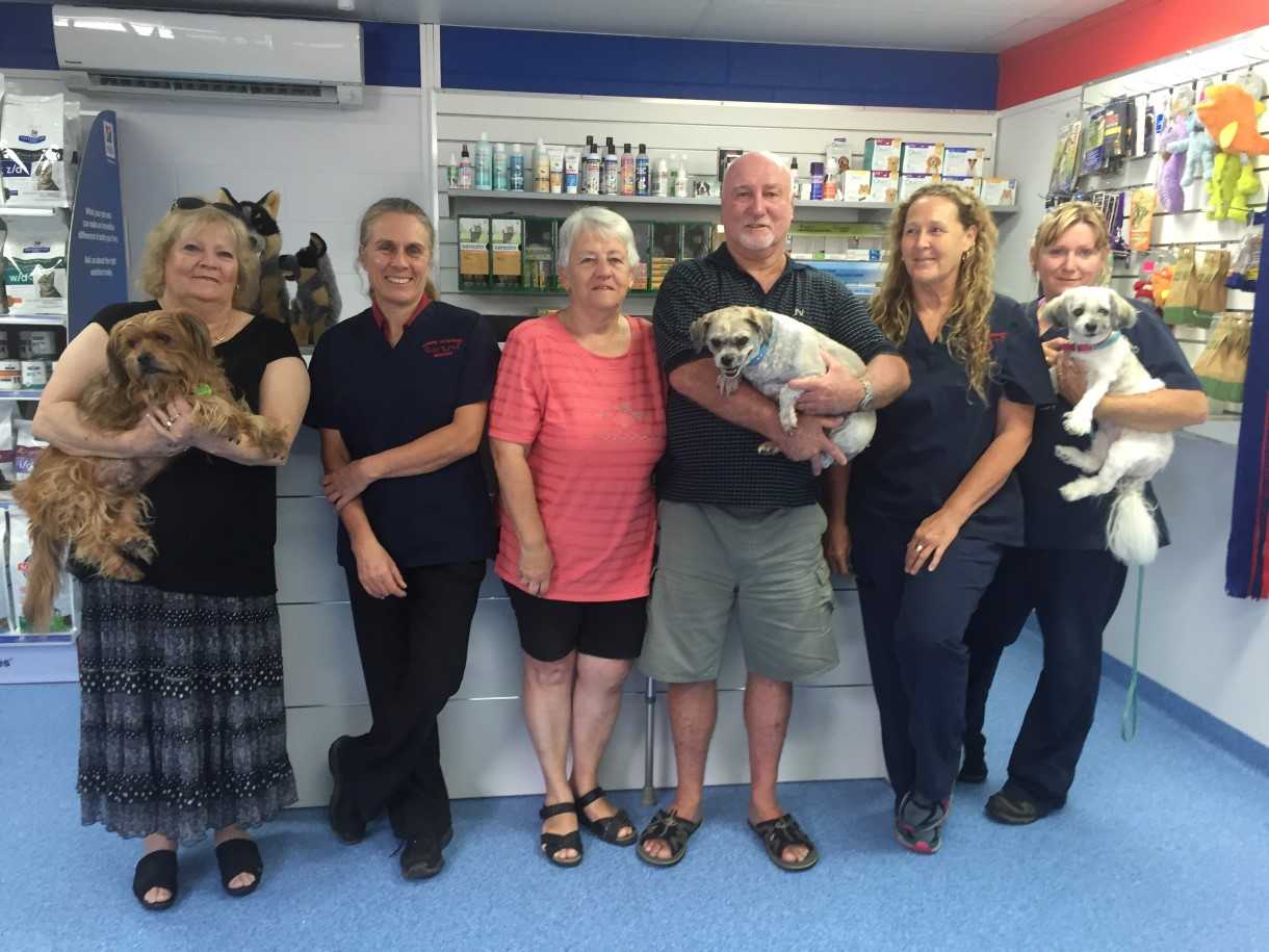 Jenny Eising with Buddy, vet Dr Cathy Milgate, Carol and Terry James with Scruff, team members Sandy Morton and Debbie Davey