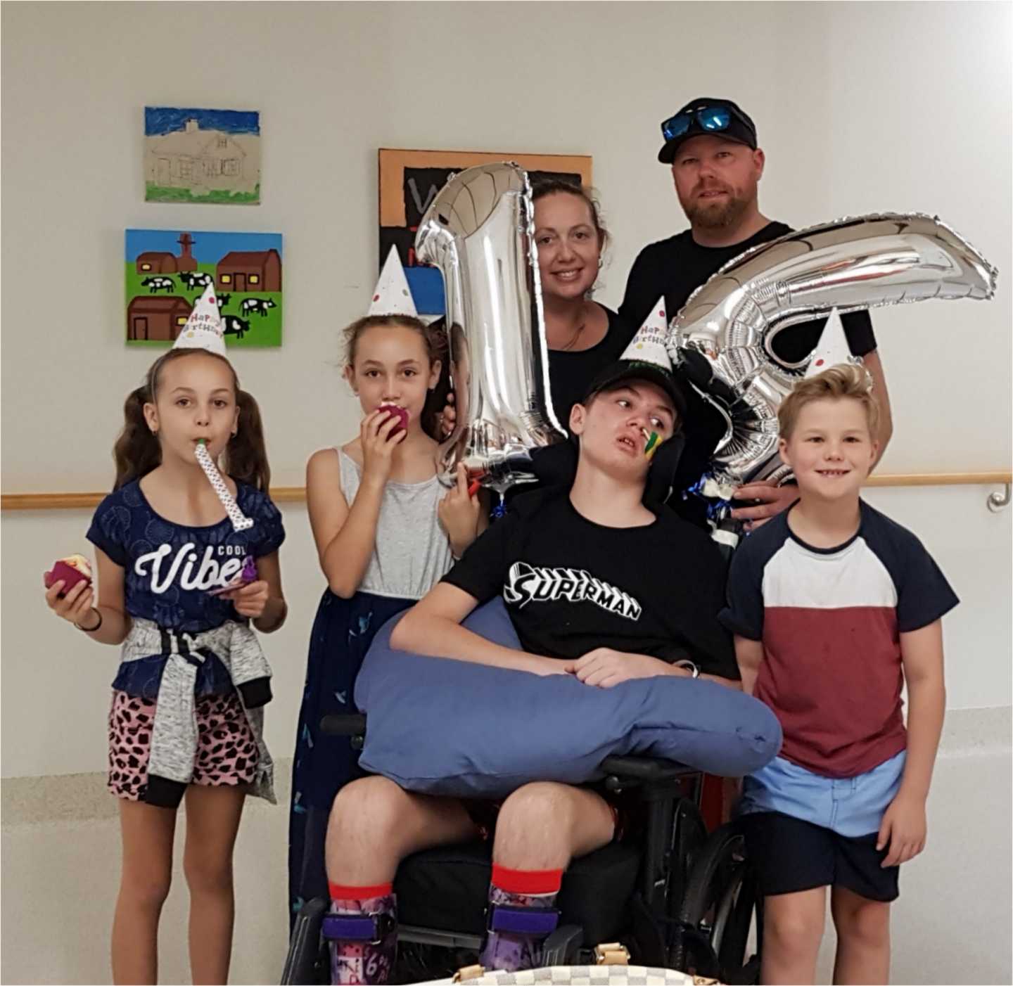 Carolyn and Dave Elder with Paige, and Jack celebrate Tristan’s 14th birthday in hospital last month - they will be glad to have him home for Christmas 