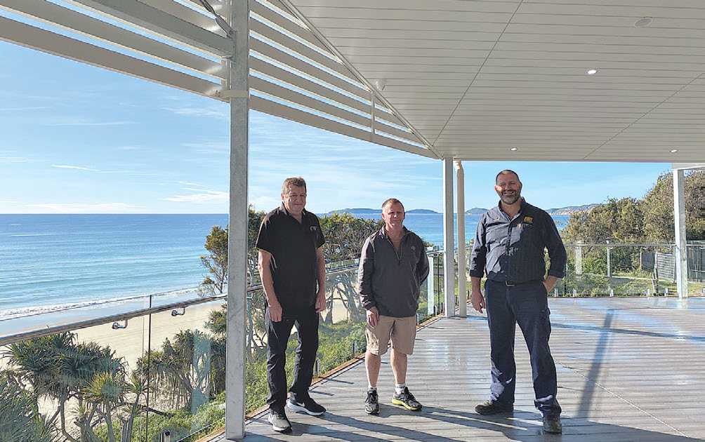 Surf Club General Manager, Ray Holland, Supporters Club President, John Greaney and Surf Club President, Shane Handy take their first walk out on the new verandah.