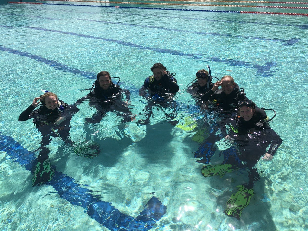 Discover Scuba Divers trying diving for the first time at Rainbow Beach Pool before they headed to Round Rock, the ‘nursery' dive site