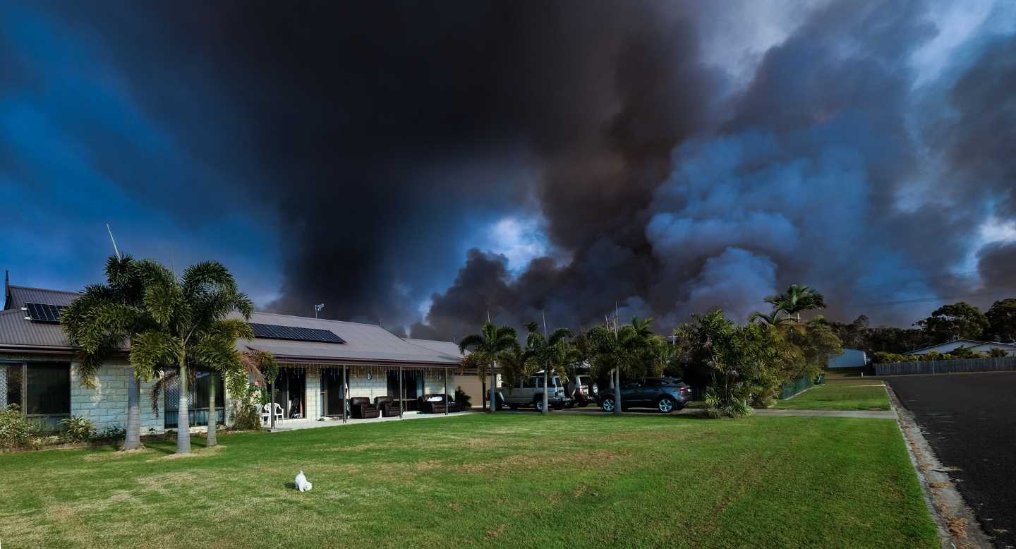 Peter Thwaites took this dramatic photo in front of his home in Cooloola Cove, entitled  ".... when you've just got to have faith in the local fire fighting crews during their winter burn off."