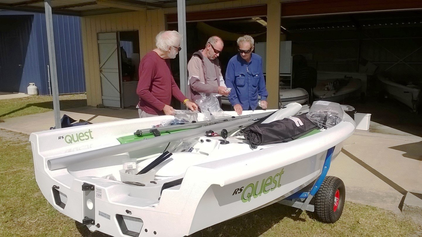 Russell, Mike and Bob of the Tin Can Bay Yacht Club wondering which parts are which and where they go on their new RS Quests