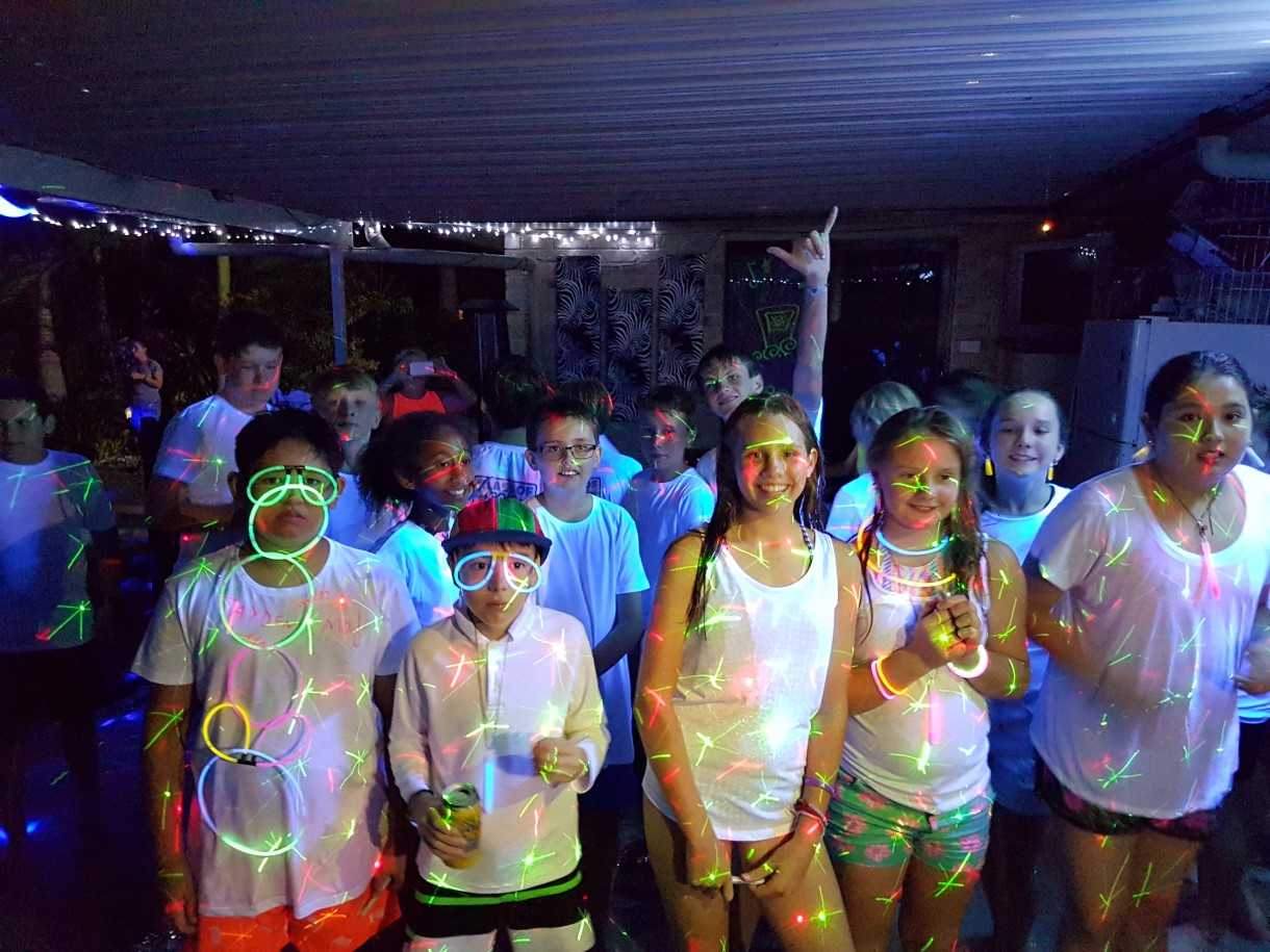 The neon pool party for Tin Can Bay Year 6 was called an "awesome" celebration