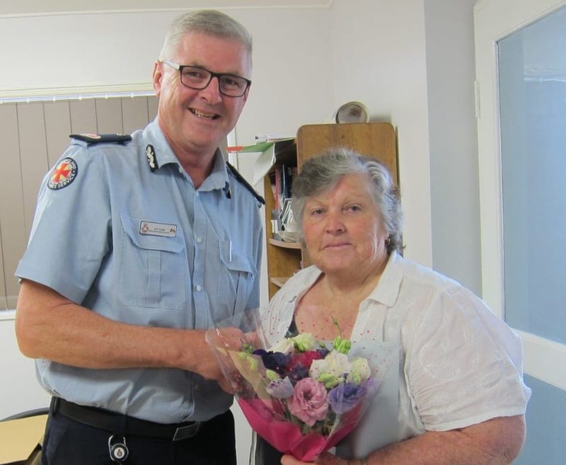Lillian Clark being presented with her 40 years of service medal by Acting Assistant Commissioner, Ian Tar