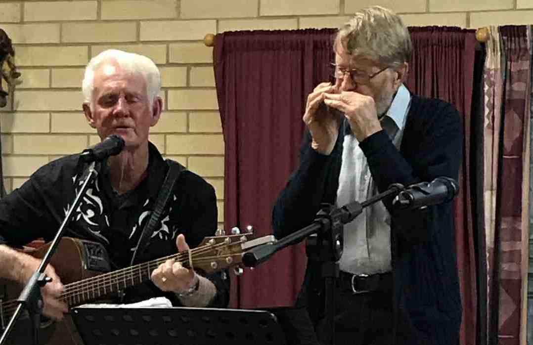 Ron on guitar and Len on harmonica at a Music Plus event pre Covid