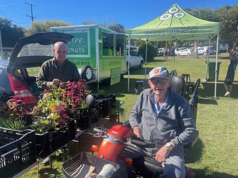 Stallholder Paul Pickett and Rainbow identity John Seul enjoy perfect market conditions in July