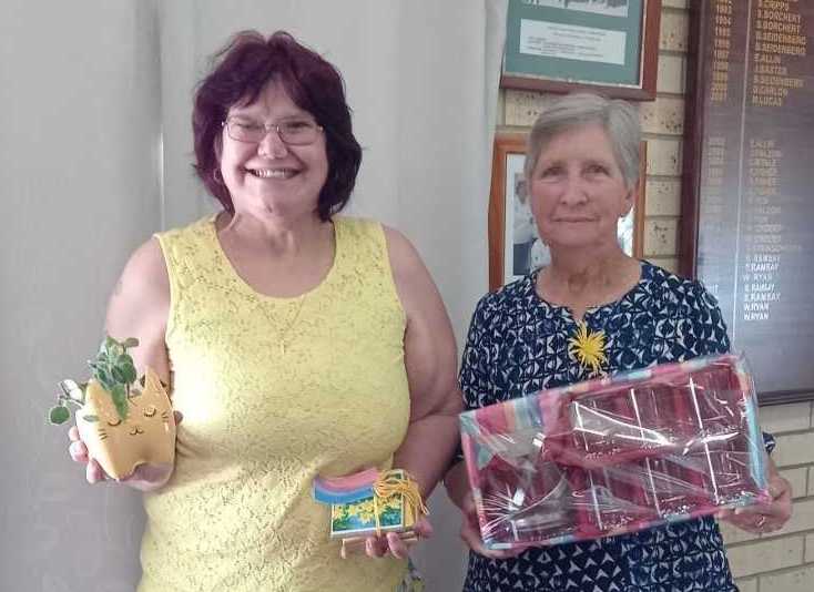 Our lucky hoy winners from Daffodil Day show off their lovely prizes