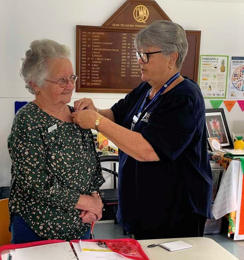 QCWA - Mollie receiving her replacement Gold Service Badge from Wendy