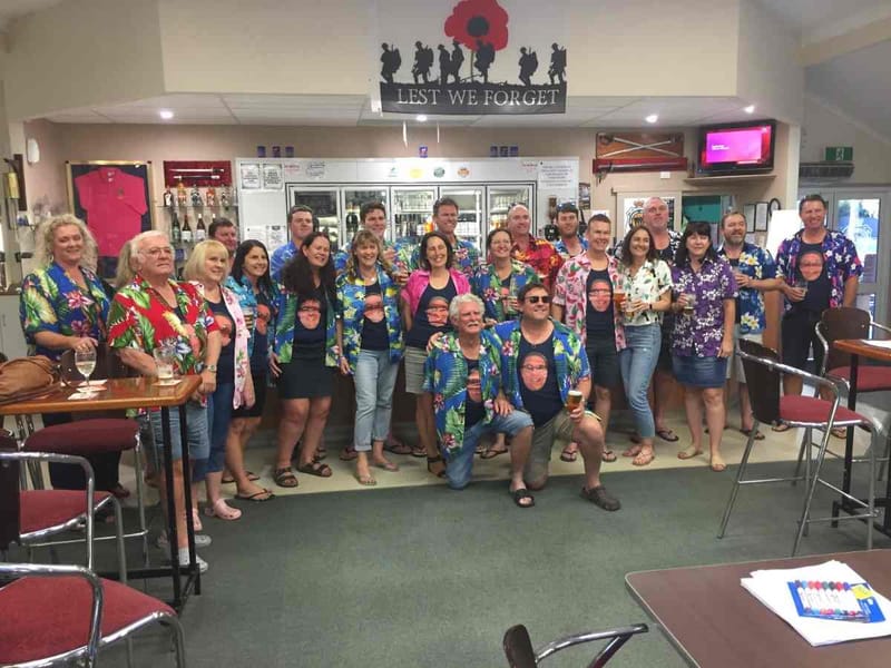 Birthday celebrations being enjoyed by a colourful crowd at the Tin Can Bay RSL