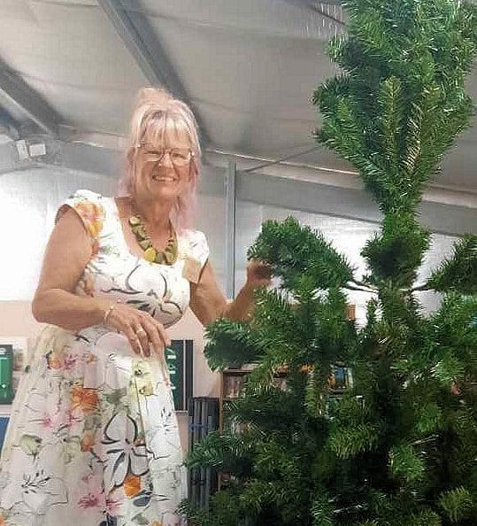 Where would we be without Yvonne? Here she is happily starting work on decorating our Christmas tree. What a star!